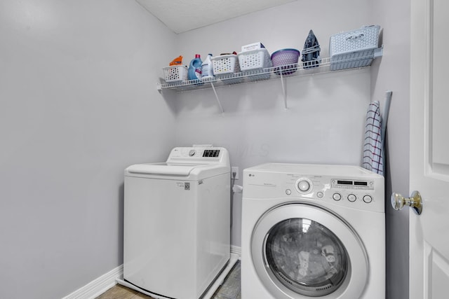 1626 Geranium Dr, Lewis Center, OH 43035 - washroom with washing machine and clothes dryer and baseboards