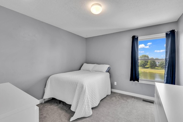 1626 Geranium Dr, Lewis Center, OH 43035 - carpeted bedroom with a textured ceiling and baseboards