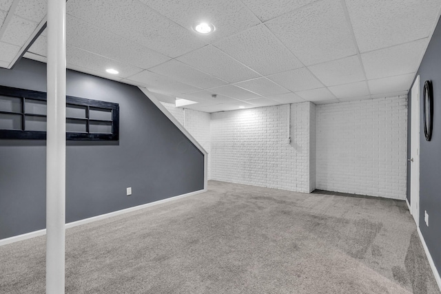 1626 Geranium Dr, Lewis Center, OH 43035 - finished below grade area featuring brick wall, carpet flooring, a paneled ceiling, and recessed lighting