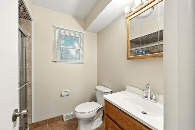 4972 Woodbriar Pl, Columbus, OH 43229 - full bath featuring vanity, a shower with door, and tile patterned floors