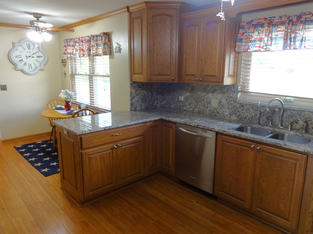 1766 Thrailkill Rd, Grove City, OH 43123 - kitchen featuring dishwasher, ceiling fan, brown cabinetry, backsplash, and light stone counters