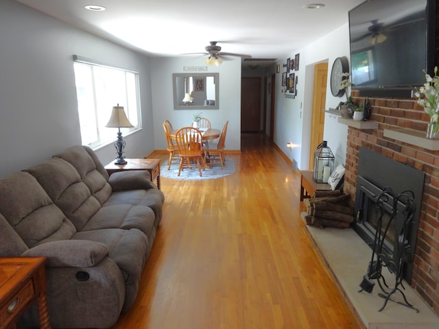 1766 Thrailkill Rd, Grove City, OH 43123 - living area featuring ceiling fan, light wood finished floors, and a brick fireplace