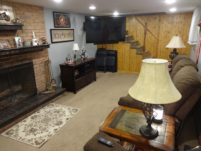 1766 Thrailkill Rd, Grove City, OH 43123 - living area featuring carpet, wood walls, stairway, and a fireplace