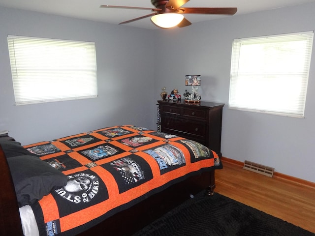 1766 Thrailkill Rd, Grove City, OH 43123 - bedroom with wood finished floors, multiple windows, and a ceiling fan