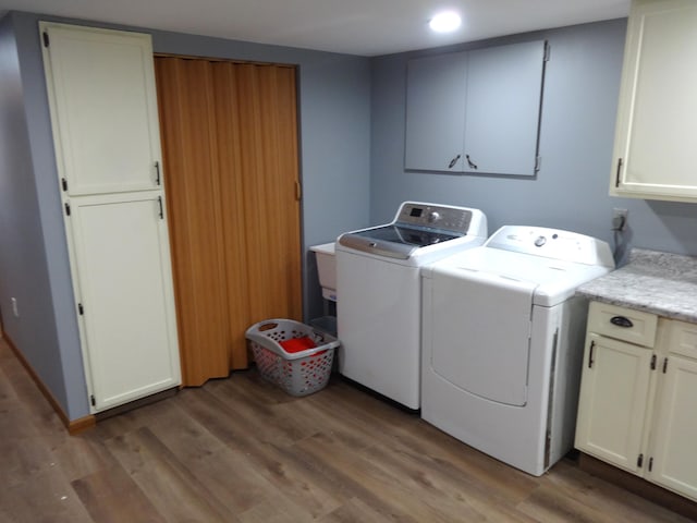 1766 Thrailkill Rd, Grove City, OH 43123 - washroom with cabinet space, washing machine and dryer, light wood-style flooring, and recessed lighting