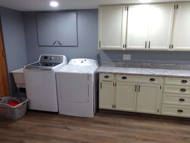 1766 Thrailkill Rd, Grove City, OH 43123 - washroom featuring cabinet space, washing machine and clothes dryer, wood finished floors, and recessed lighting