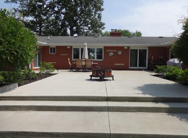 1766 Thrailkill Rd, Grove City, OH 43123 - rear view of property with brick siding, a patio, and a chimney