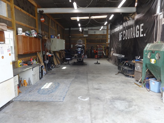 1766 Thrailkill Rd, Grove City, OH 43123 - garage featuring a workshop area and freestanding refrigerator
