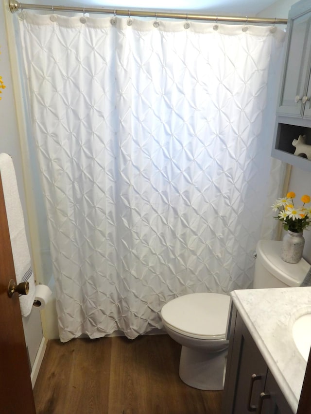 1766 Thrailkill Rd, Grove City, OH 43123 - full bathroom featuring wood finished floors, vanity, and shower / tub combo with curtain