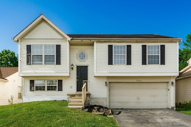 5727 Sundial Dr, Galloway, OH 43119 - bi-level home with a garage, concrete driveway, and a front lawn