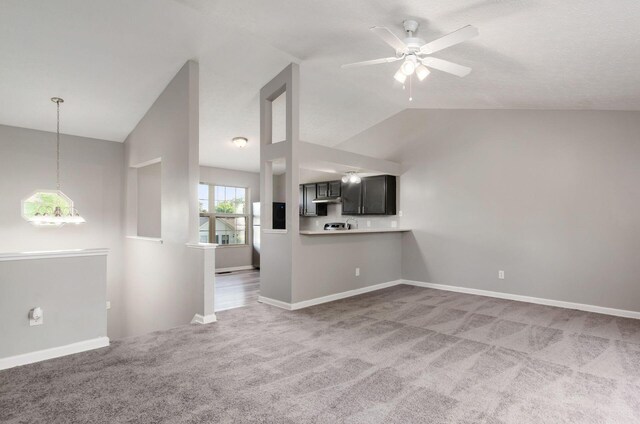 5727 Sundial Dr, Galloway, OH 43119 - unfurnished living room featuring lofted ceiling, light colored carpet, and ceiling fan