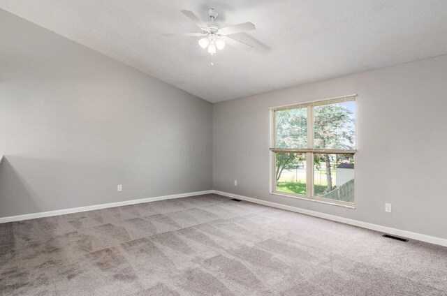 5727 Sundial Dr, Galloway, OH 43119 - unfurnished room with carpet flooring, ceiling fan, and vaulted ceiling