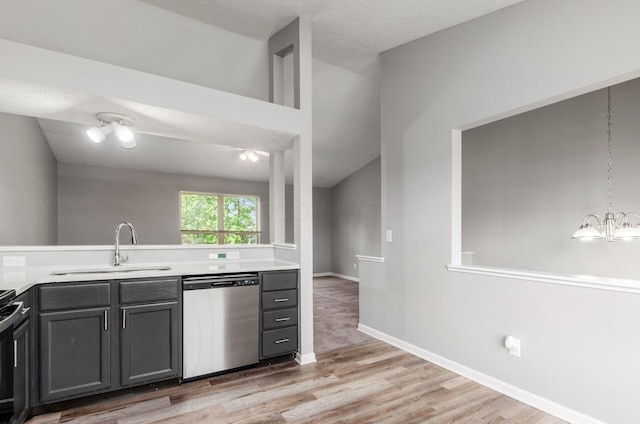 5727 Sundial Dr, Galloway, OH 43119 - kitchen with dishwasher, light wood-style floors, light countertops, and a chandelier
