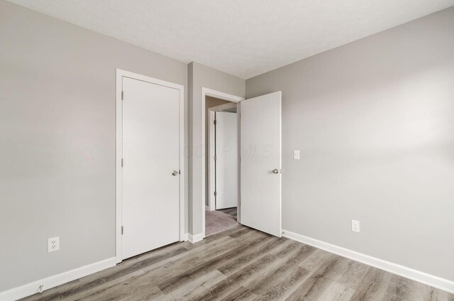 5727 Sundial Dr, Galloway, OH 43119 - unfurnished bedroom featuring wood finished floors
