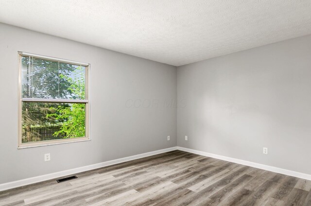5727 Sundial Dr, Galloway, OH 43119 - unfurnished room with wood finished floors and a textured ceiling