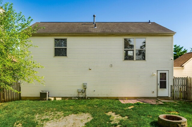 5727 Sundial Dr, Galloway, OH 43119 - rear view of house with an outdoor fire pit