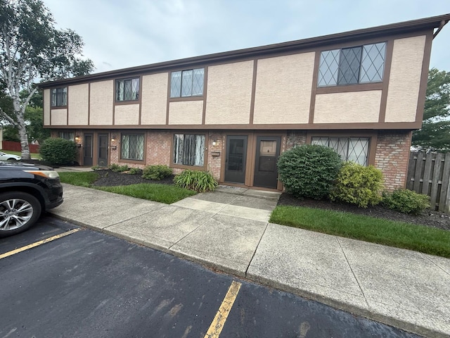 5600 Cartwright Ln Unit 19, Columbus, OH 43231 - multi unit property with uncovered parking, brick siding, and stucco siding