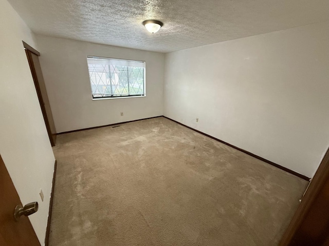 5600 Cartwright Ln Unit 19, Columbus, OH 43231 - empty room with a textured ceiling and light carpet