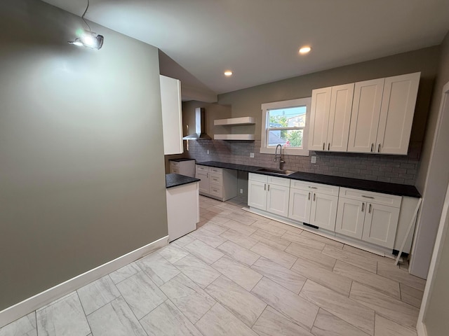 274 Woods Ave, Newark, OH 43055 - kitchen with wall chimney range hood, tasteful backsplash, light marble finish flooring, white cabinetry, and recessed lighting