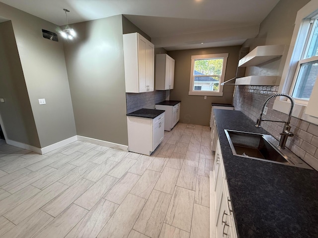 274 Woods Ave, Newark, OH 43055 - kitchen featuring open shelves, decorative backsplash, white cabinets, and light wood-type flooring