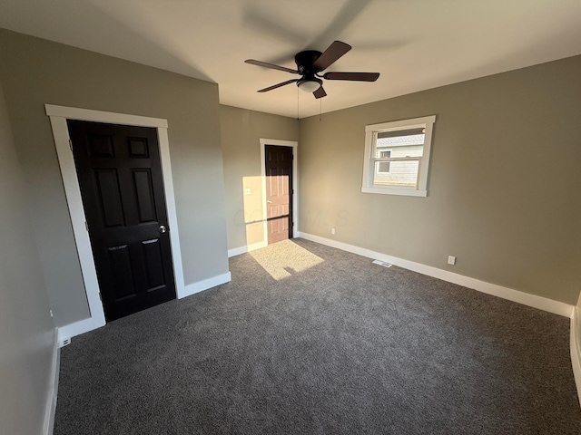 274 Woods Ave, Newark, OH 43055 - unfurnished bedroom featuring dark carpet and a ceiling fan