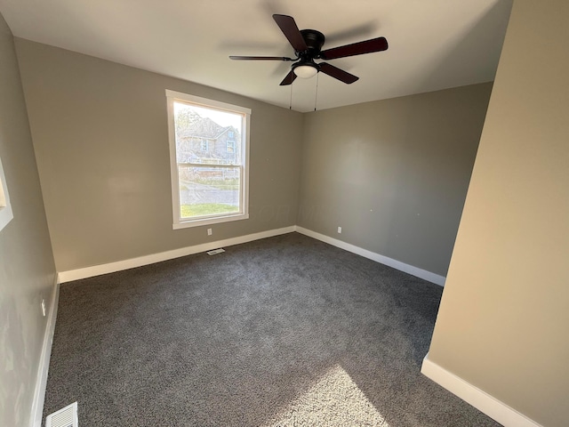 274 Woods Ave, Newark, OH 43055 - spare room featuring dark colored carpet and ceiling fan
