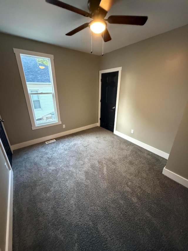 274 Woods Ave, Newark, OH 43055 - unfurnished bedroom featuring carpet flooring and a ceiling fan