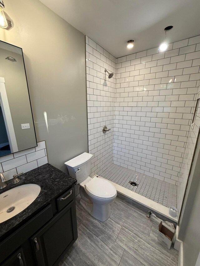 274 Woods Ave, Newark, OH 43055 - bathroom with vanity, a shower stall, and tasteful backsplash