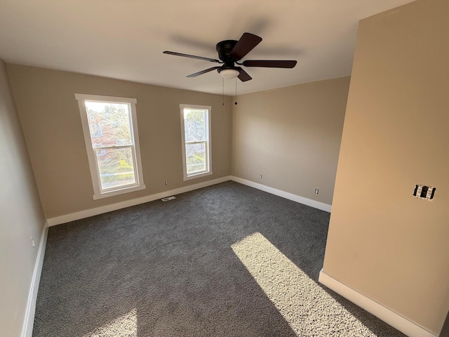 274 Woods Ave, Newark, OH 43055 - unfurnished room featuring dark colored carpet and ceiling fan
