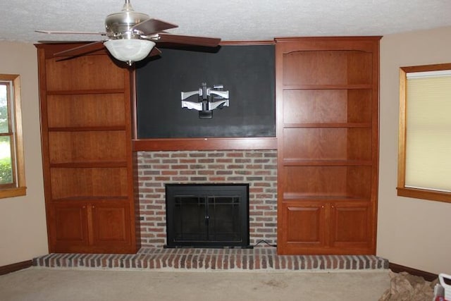 6781 Thoreau Ln NE, Baltimore, OH 43105 - unfurnished living room featuring a brick fireplace, a textured ceiling, a ceiling fan, and carpet flooring