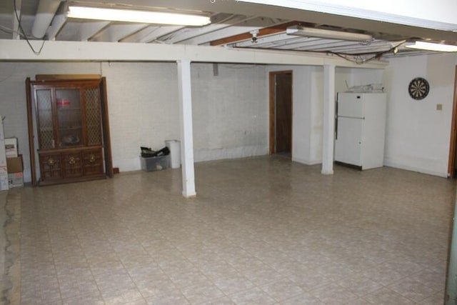6781 Thoreau Ln NE, Baltimore, OH 43105 - finished below grade area with freestanding refrigerator and light floors