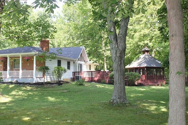6781 Thoreau Ln NE, Baltimore, OH 43105 - view of grassy yard featuring a gazebo and a porch