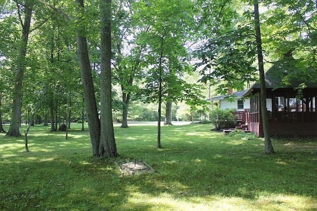 6781 Thoreau Ln NE, Baltimore, OH 43105 - view of grassy yard with a wooden deck