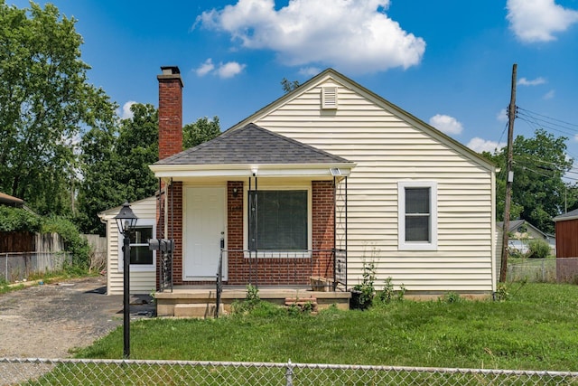 1680 Linwood Ave, Columbus, OH 43207 - bungalow-style home featuring covered porch, a chimney, and roof with shingles