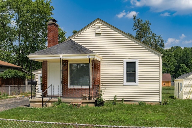 1680 Linwood Ave, Columbus, OH 43207 - bungalow-style home featuring a chimney, roof with shingles, and brick siding