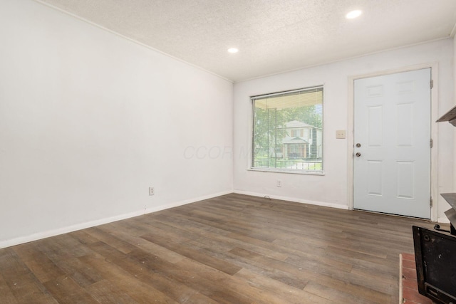 1680 Linwood Ave, Columbus, OH 43207 - foyer entrance with wood finished floors, a textured ceiling, and recessed lighting