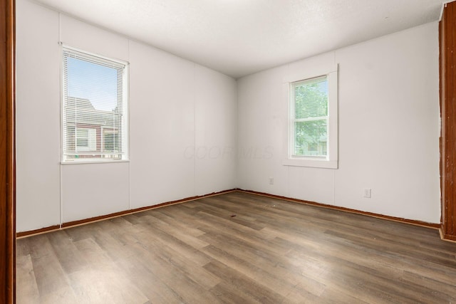 1680 Linwood Ave, Columbus, OH 43207 - spare room featuring wood finished floors and baseboards