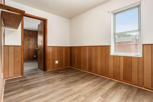 1680 Linwood Ave, Columbus, OH 43207 - unfurnished room featuring wainscoting, wood finished floors, and crown molding