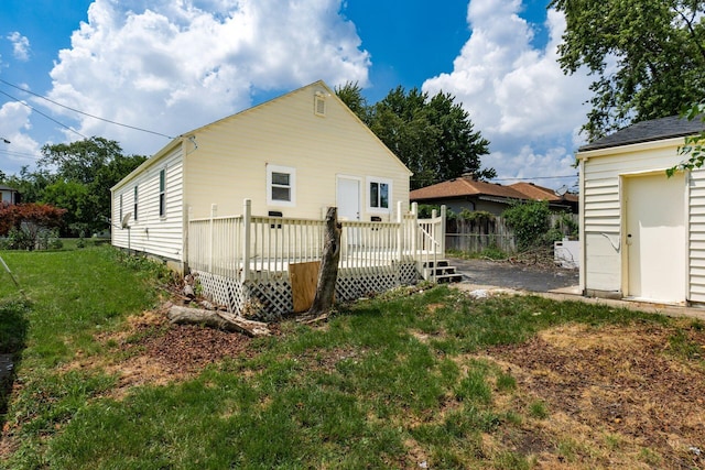 1680 Linwood Ave, Columbus, OH 43207 - rear view of property with a lawn, a wooden deck, and an outdoor structure