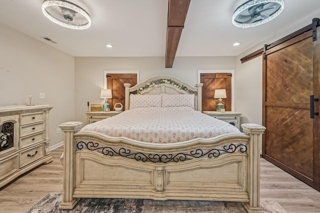 15586 Stump Run, Laurelville, OH 43135 - bedroom with a barn door, light wood-style floors, beamed ceiling, and recessed lighting