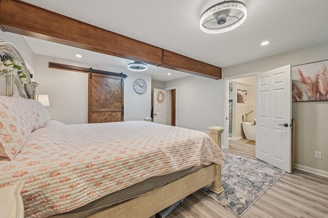 15586 Stump Run, Laurelville, OH 43135 - bedroom featuring a barn door, wood finished floors, recessed lighting, ensuite bath, and beamed ceiling