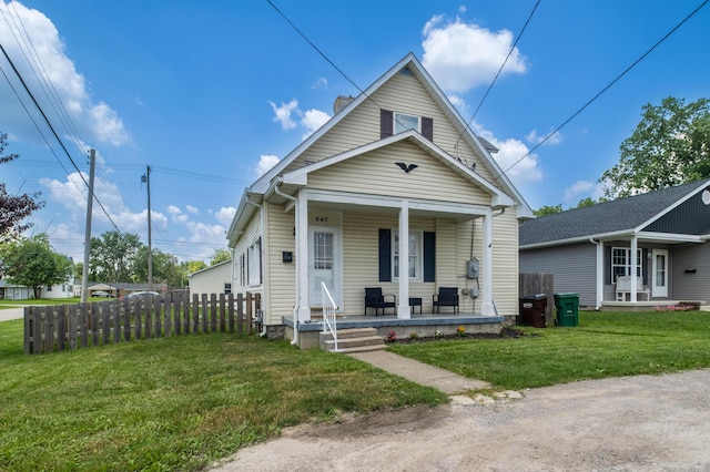 647 Harrison St, Washington Court House, OH 43160 - shotgun-style home with a porch and a chimney