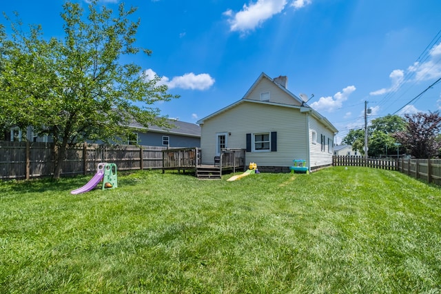 647 Harrison St, Washington Court House, OH 43160 - back of house with a wooden deck, a fenced backyard, and a chimney