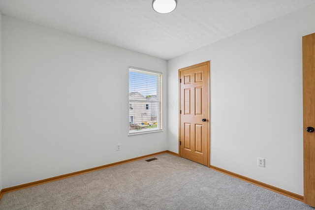 6872 Spring Bloom Dr, Canal Winchester, OH 43110 - carpeted spare room with baseboards and a textured ceiling