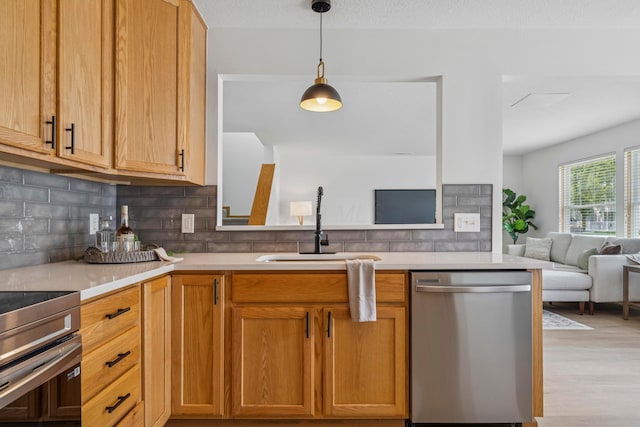 6872 Spring Bloom Dr, Canal Winchester, OH 43110 - kitchen with dishwasher, open floor plan, light countertops, and decorative backsplash
