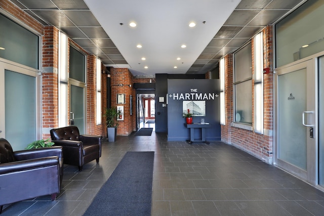 150 E Main St Unit 207, Columbus, OH 43215 - community lobby featuring brick wall and recessed lighting