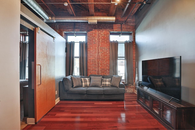 150 E Main St Unit 207, Columbus, OH 43215 - living area featuring wood finished floors, a wood ceiling with exposed beams, and healthy amount of natural light
