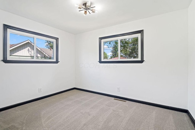 536 Pierce Ave, Columbus, OH 43213 - empty room with healthy amount of natural light and carpet