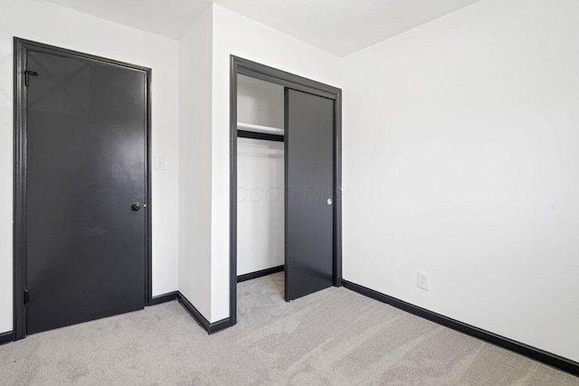 536 Pierce Ave, Columbus, OH 43213 - unfurnished bedroom featuring light carpet and a closet