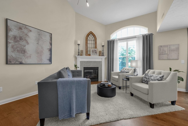 6277 Hudson Reserve Way, Westerville, OH 43081 - living room with wood finished floors, a glass covered fireplace, and lofted ceiling